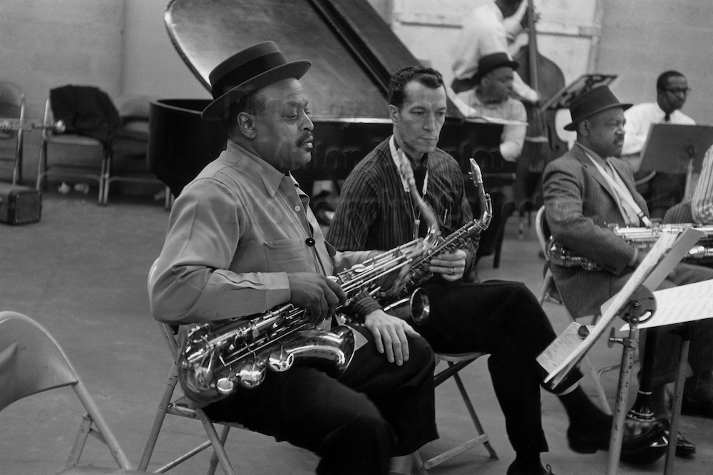 Photo by Milt Hinton<br>
© Milton J. Hinton<br>Photographic Collection <br><b class="captionn">In foreground:Ben Webster, Earle Warren, Coleman Hawkins; Count Basie (piano), Ed Jones (bass), and Freddie Greene (guitar), television studio (Sound of Jazz rehearsal), New York City, 1957</b>