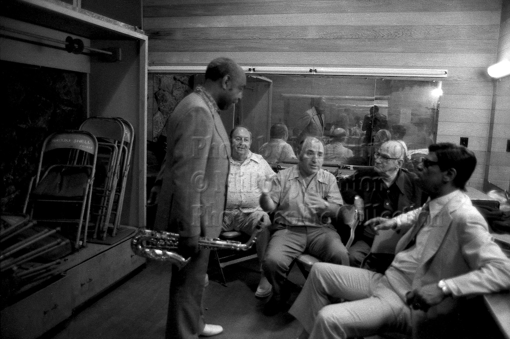 Photo by Milt Hinton<br>
© Milton J. Hinton<br>
Photographic Collection <br>
<b class="captionn">Benny Carter, Larry Wein, George Wein, and Earl Hines, Kool Jazz Festival, Honolulu, 1977</b>